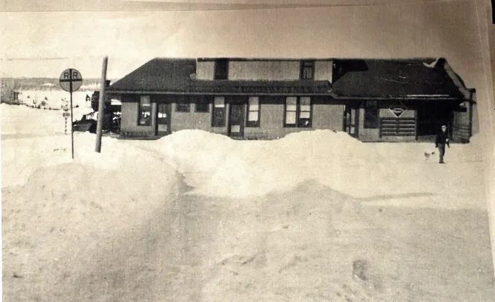The depot behind deep snowbanks