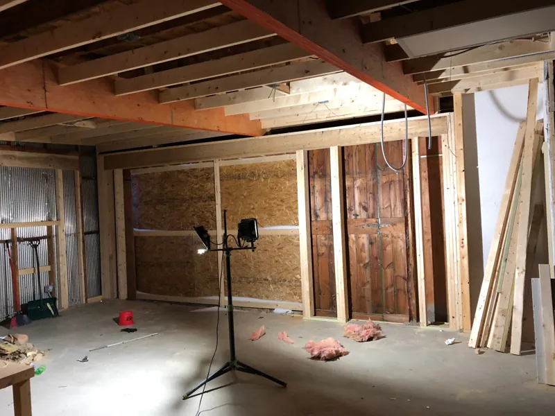 Framing inside the studio with exposed beams